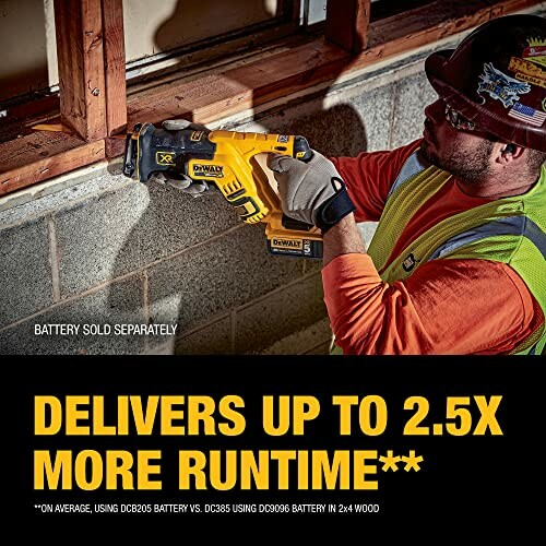 Worker using a DeWalt reciprocating saw on a construction site, highlighting extended runtime.